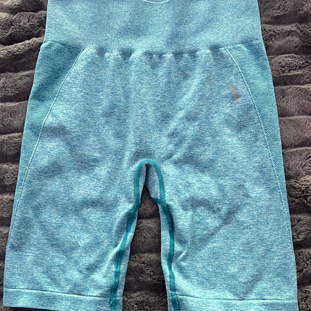 gym shark shorts, thrifted so idk size but if i had to guess i’d say M-L